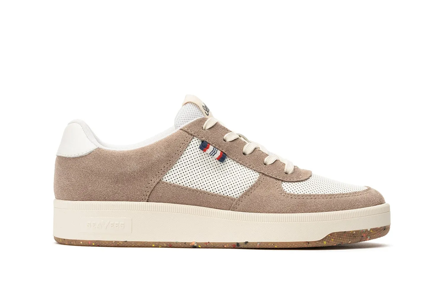 Side view of a beige and white casual sneaker with suede and mesh detailing